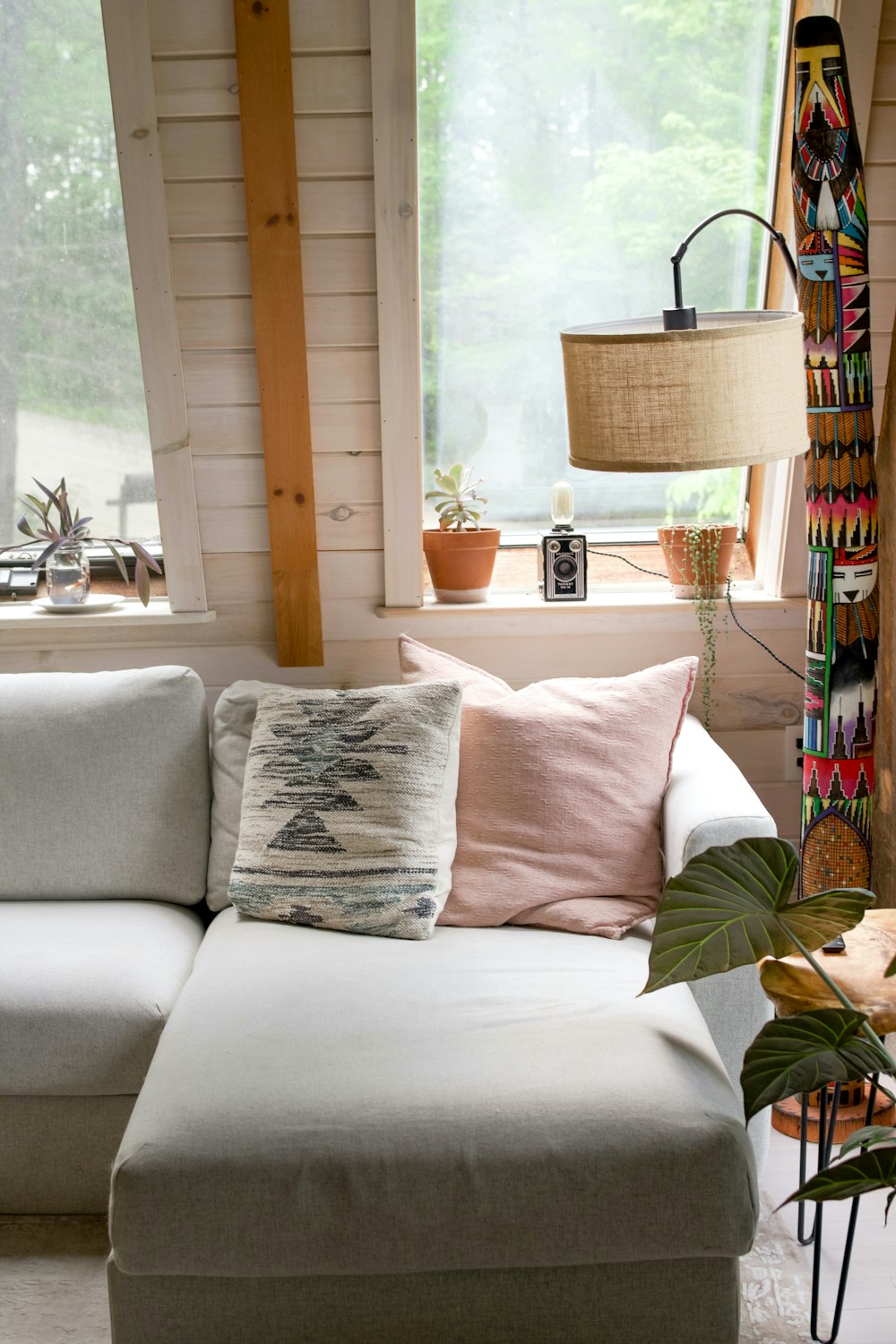 white throw pillow on white couch