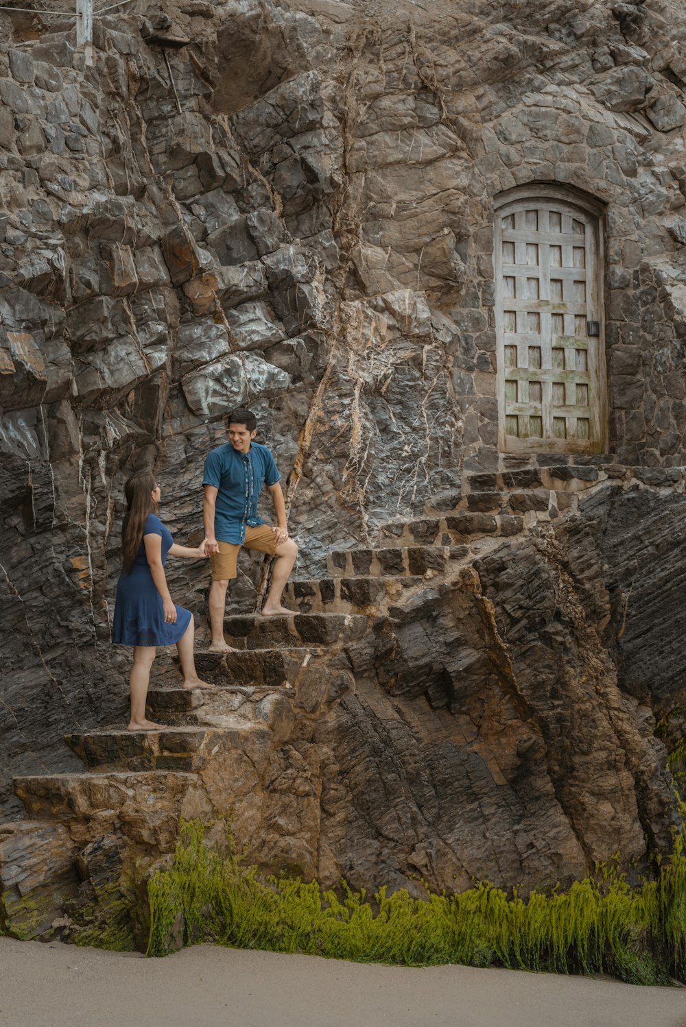 a couple of people that are standing on some steps