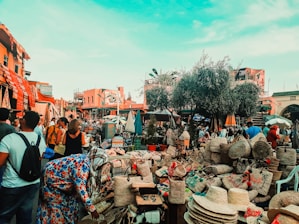 people sitting on brown wooden chairs during daytime