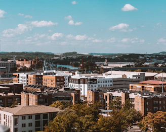 brown and white concrete buildings under blue sky during daytime