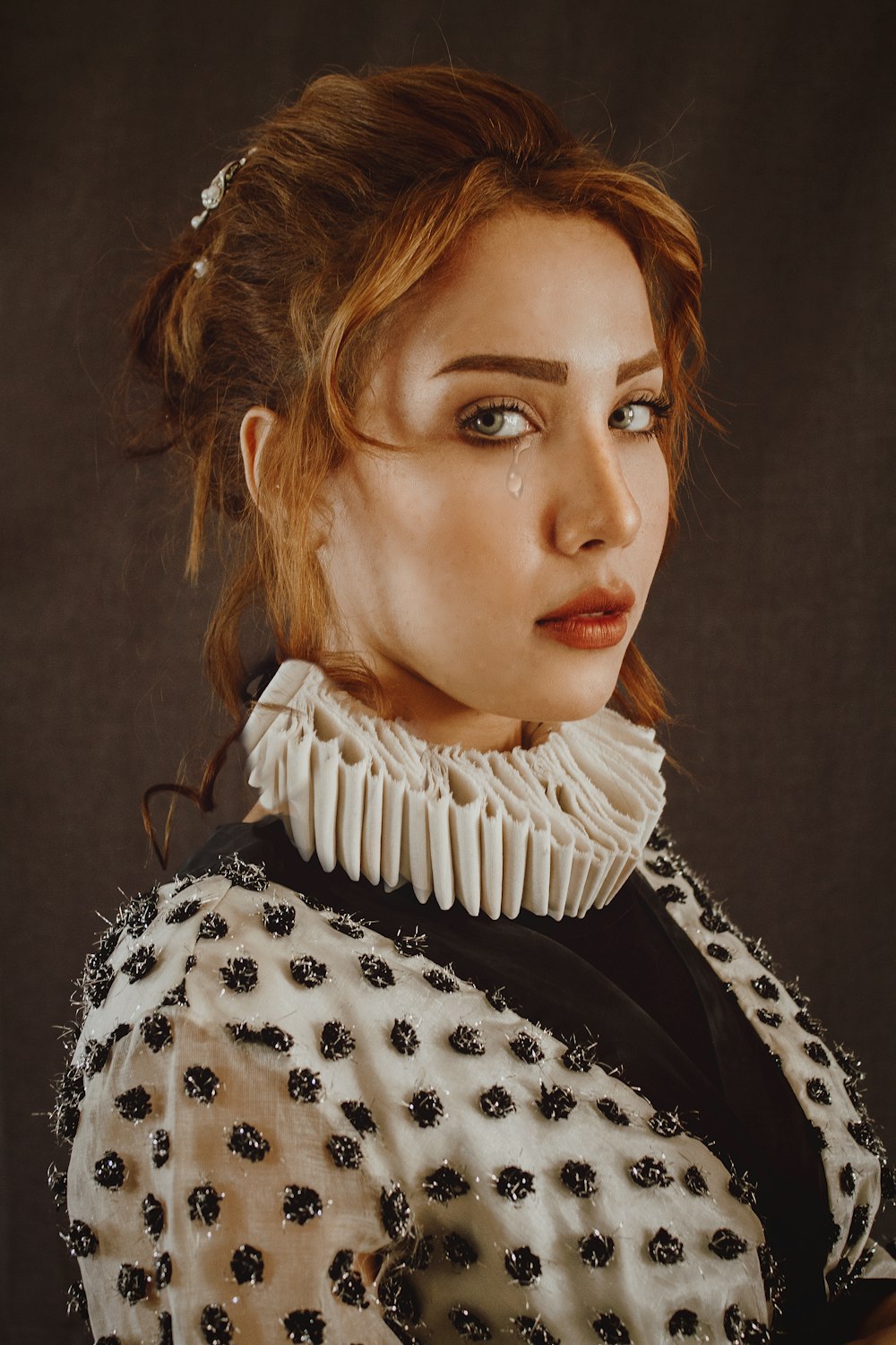 woman in black and white polka dot shirt