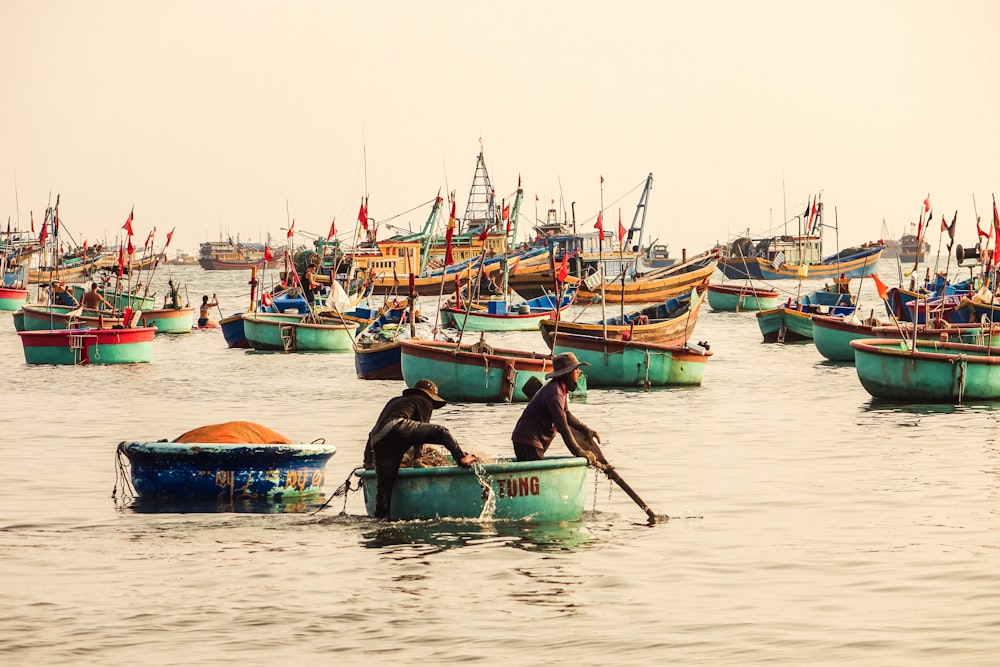 people riding on boat on water during daytime