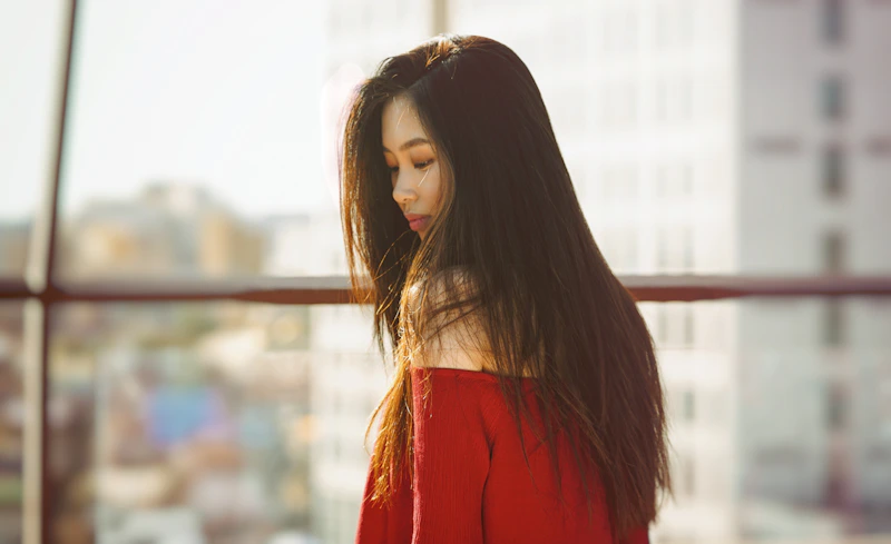 Elegant companion in red off-shoulder top, India