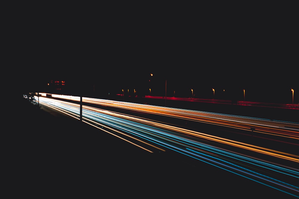 time lapse photography of cars on road during night time