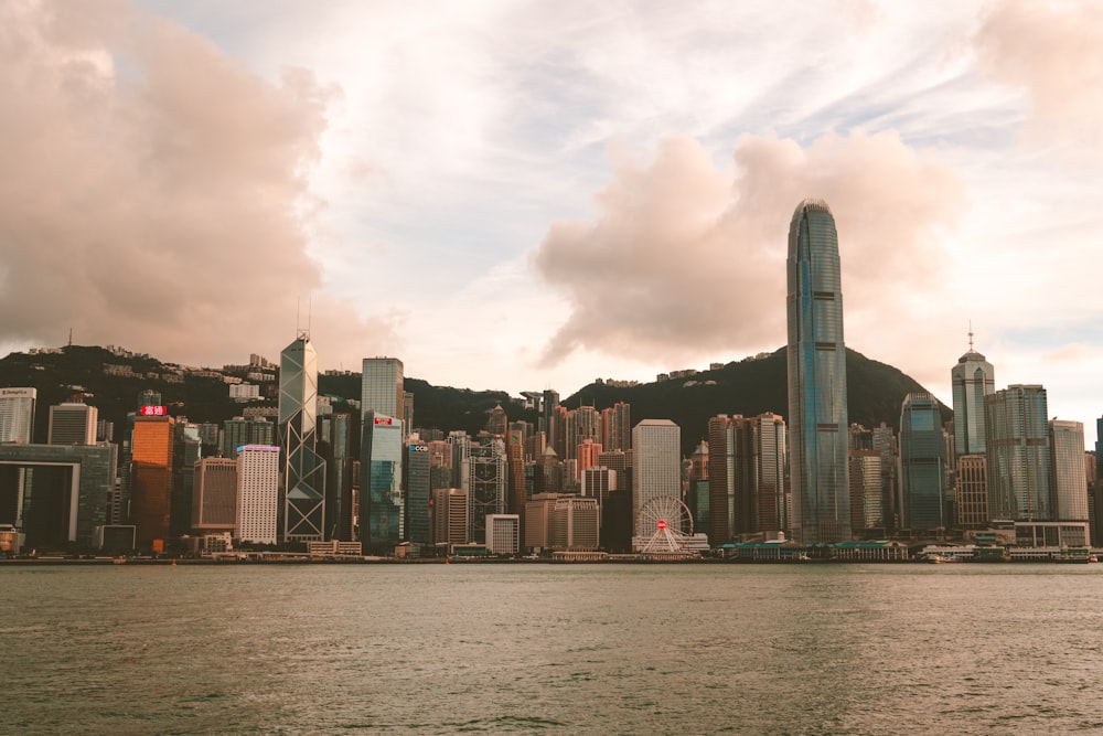 city skyline under cloudy sky during daytime