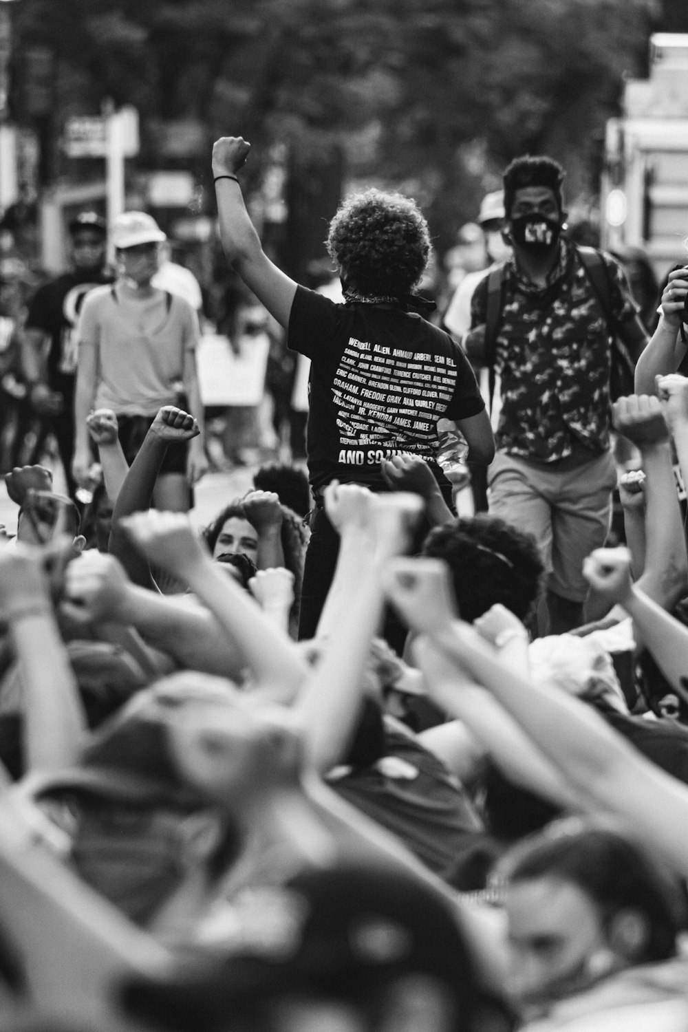 a group of people standing around each other