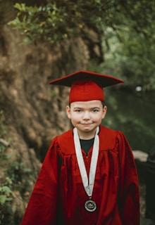 boy in red academic robe