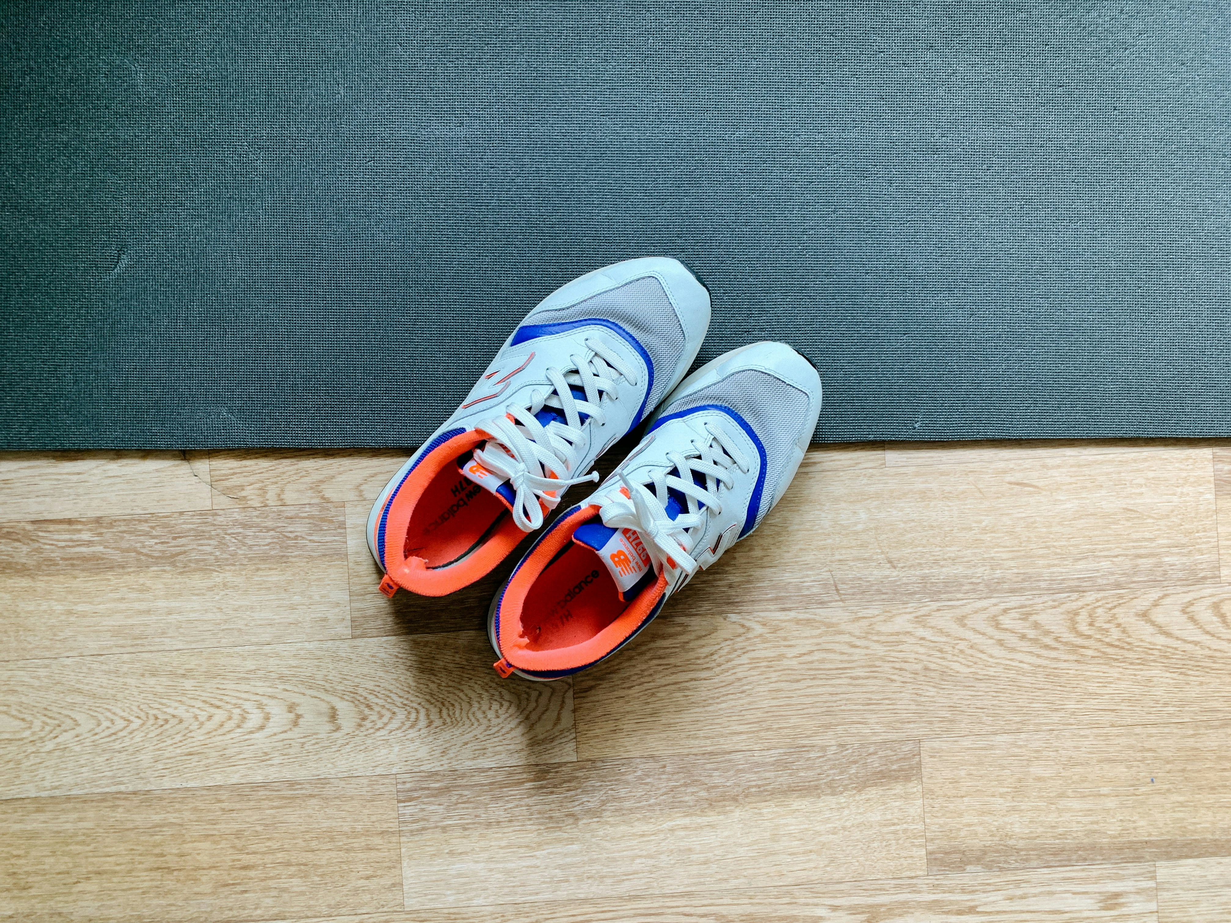 How to Choose the Right Running Shoes for Your Foot Type and Goals – blue and white sneakers on gray carpet