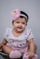 A happy baby wearing a stylish outfit from the latest collection.
