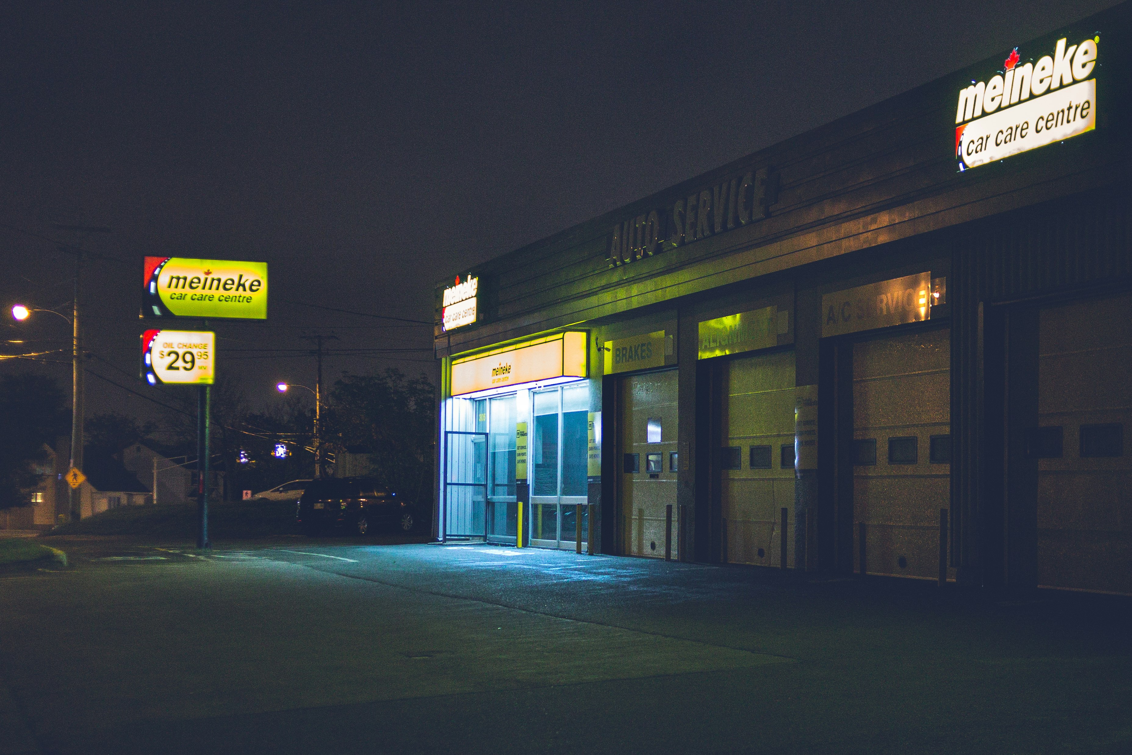 yellow and green store signage during night time