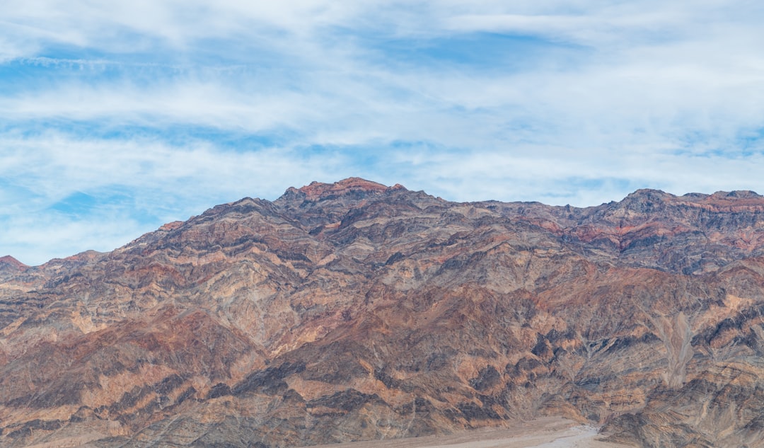 brown rocky mountain under blue sky during daytime