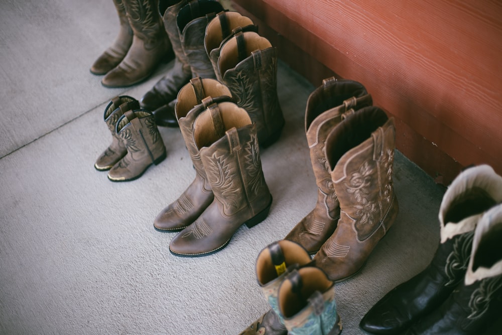 brown leather boots on gray carpet