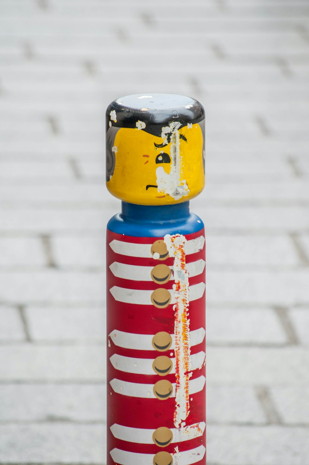 blue red and yellow striped bottle