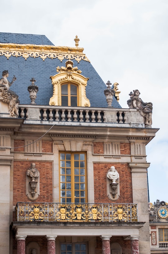 white and blue concrete building in Palace of Versailles France