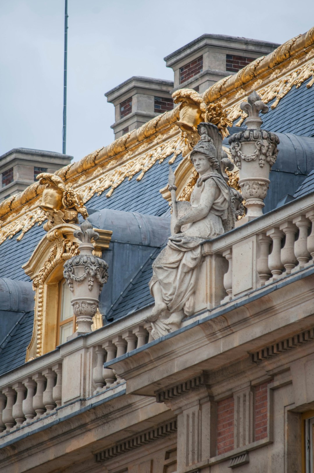 gold and white concrete statue