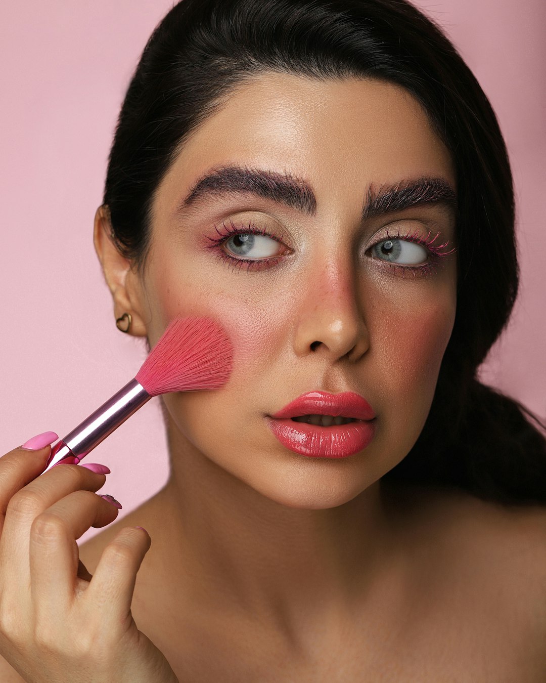 woman with red lipstick and black mascara