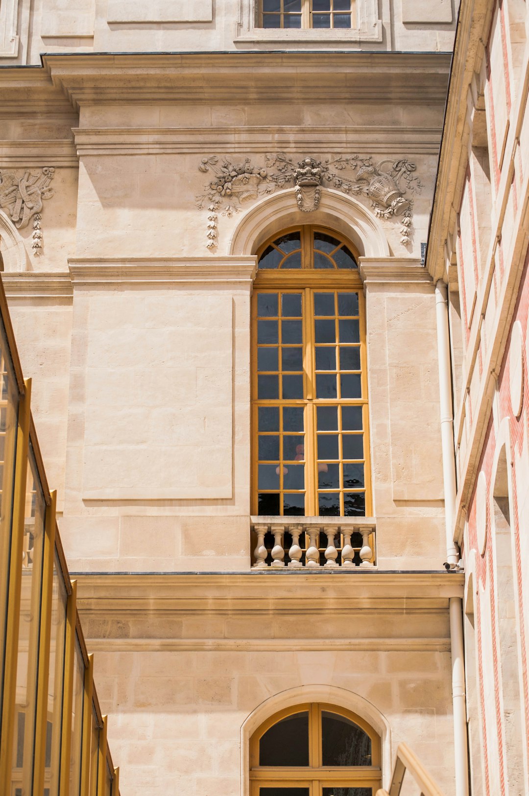 brown wooden door on white concrete building