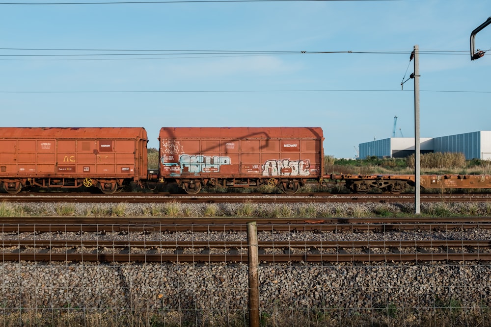 brown train on rail tracks during daytime