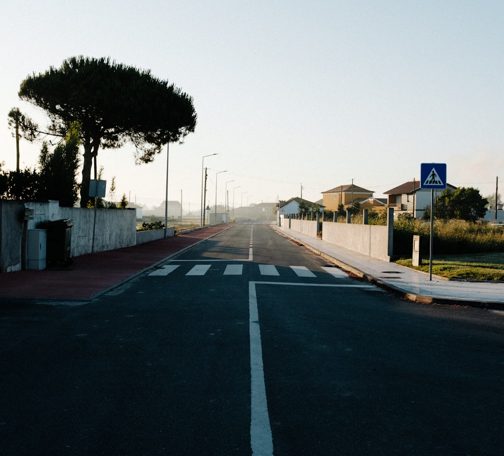 gray asphalt road with no cars during daytime