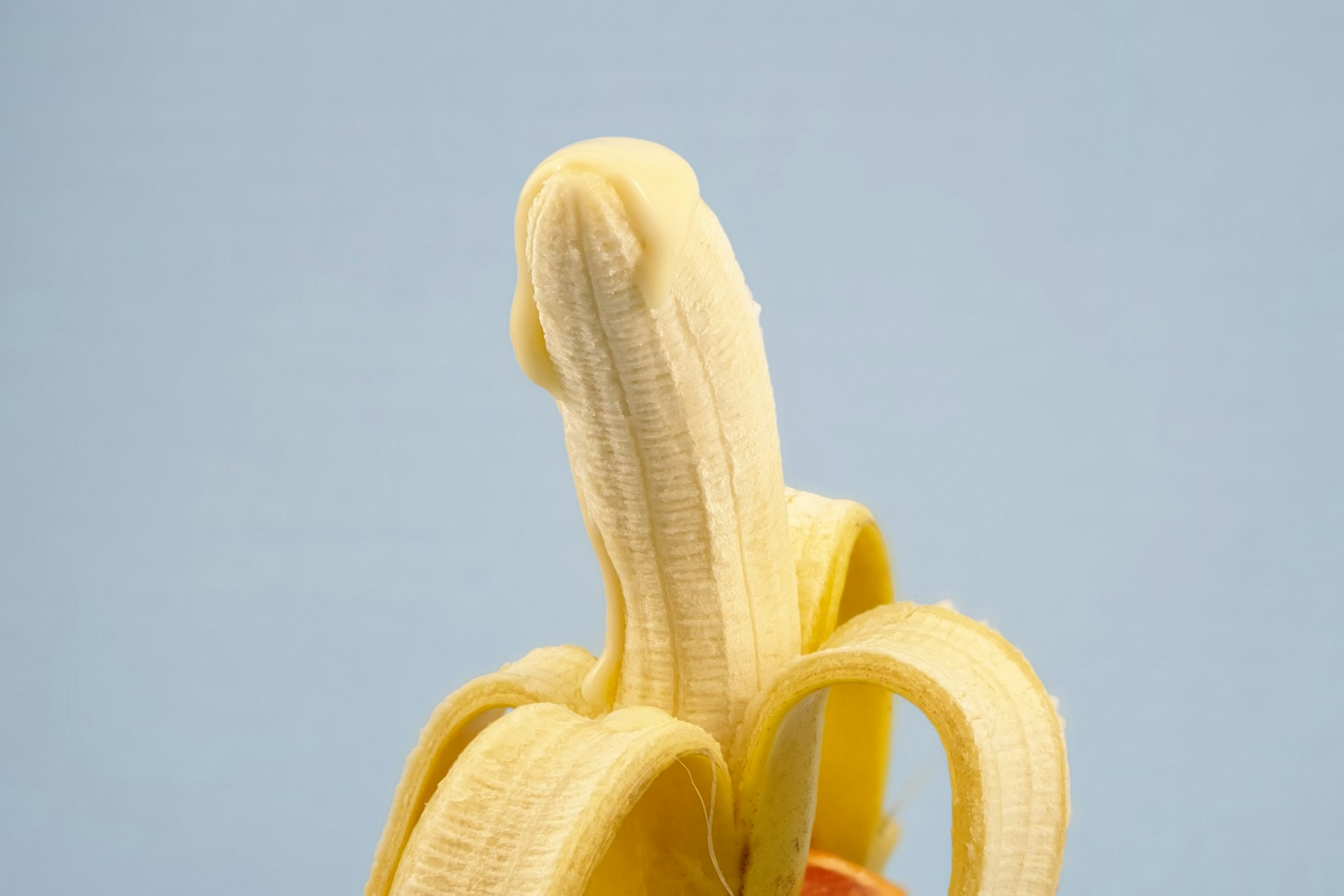  A strong banana has cream on its top