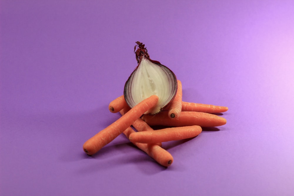 garlic bulb beside carrot and carrot