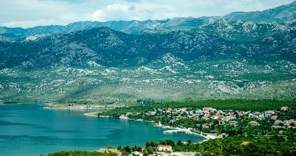 green mountains near body of water during daytime