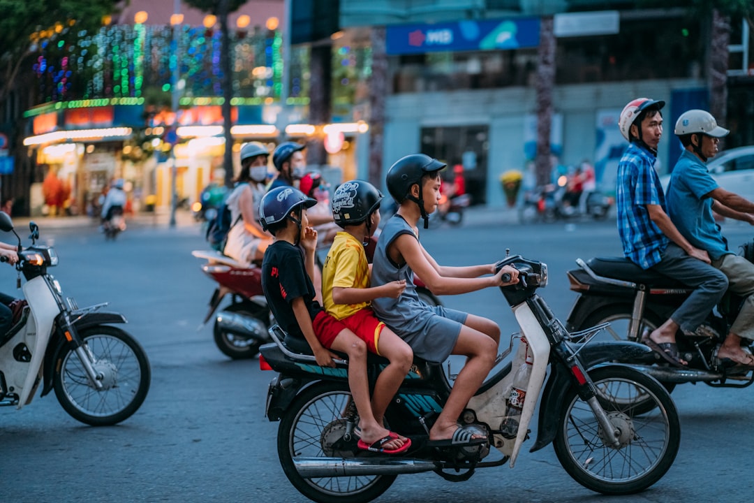 man in yellow shirt riding motorcycle with woman in yellow shirt, the one and only Saigon