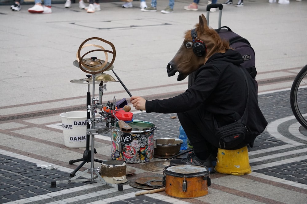 woman in black jacket holding ice cream cone with ice cream cone and brown horse