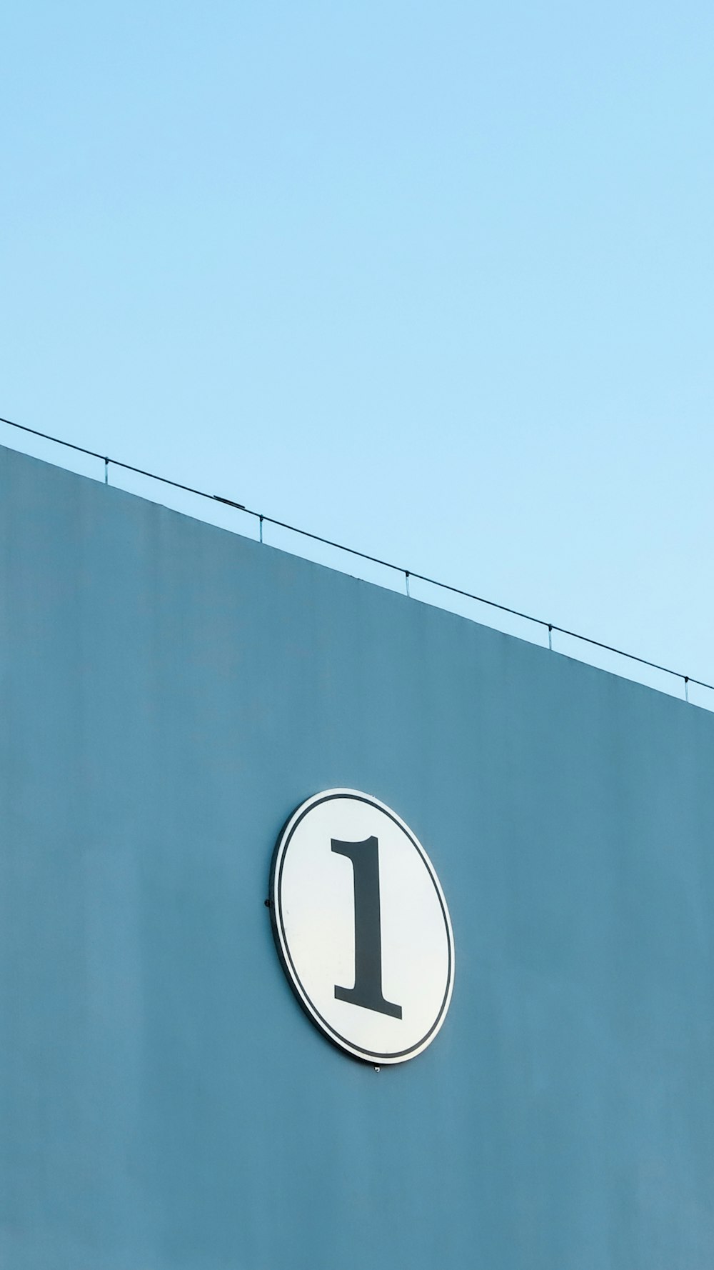 blue and white round sign