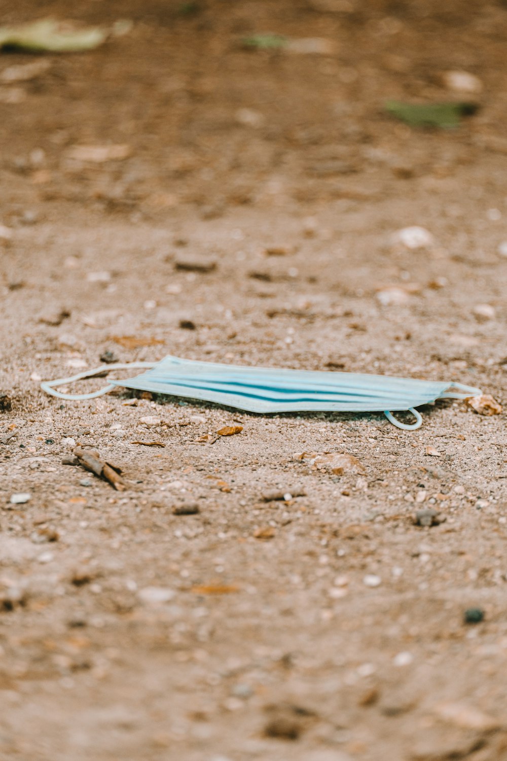 blue textile on brown soil