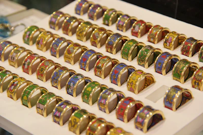 A set of rings arranged in a creative layout on a marble table.