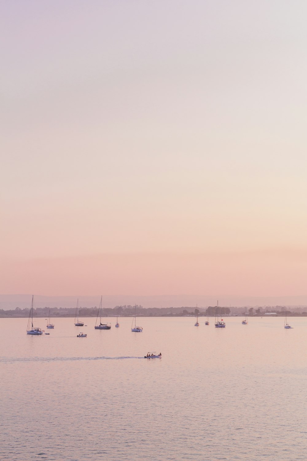 silhouette of people riding on boat on sea during daytime