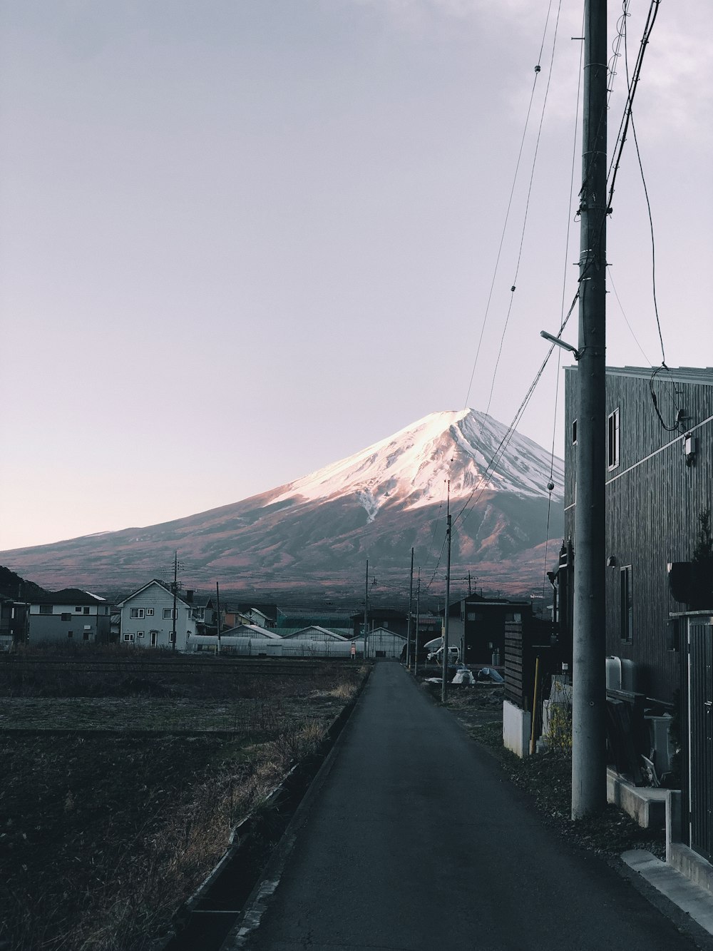 a road with a mountain in the background