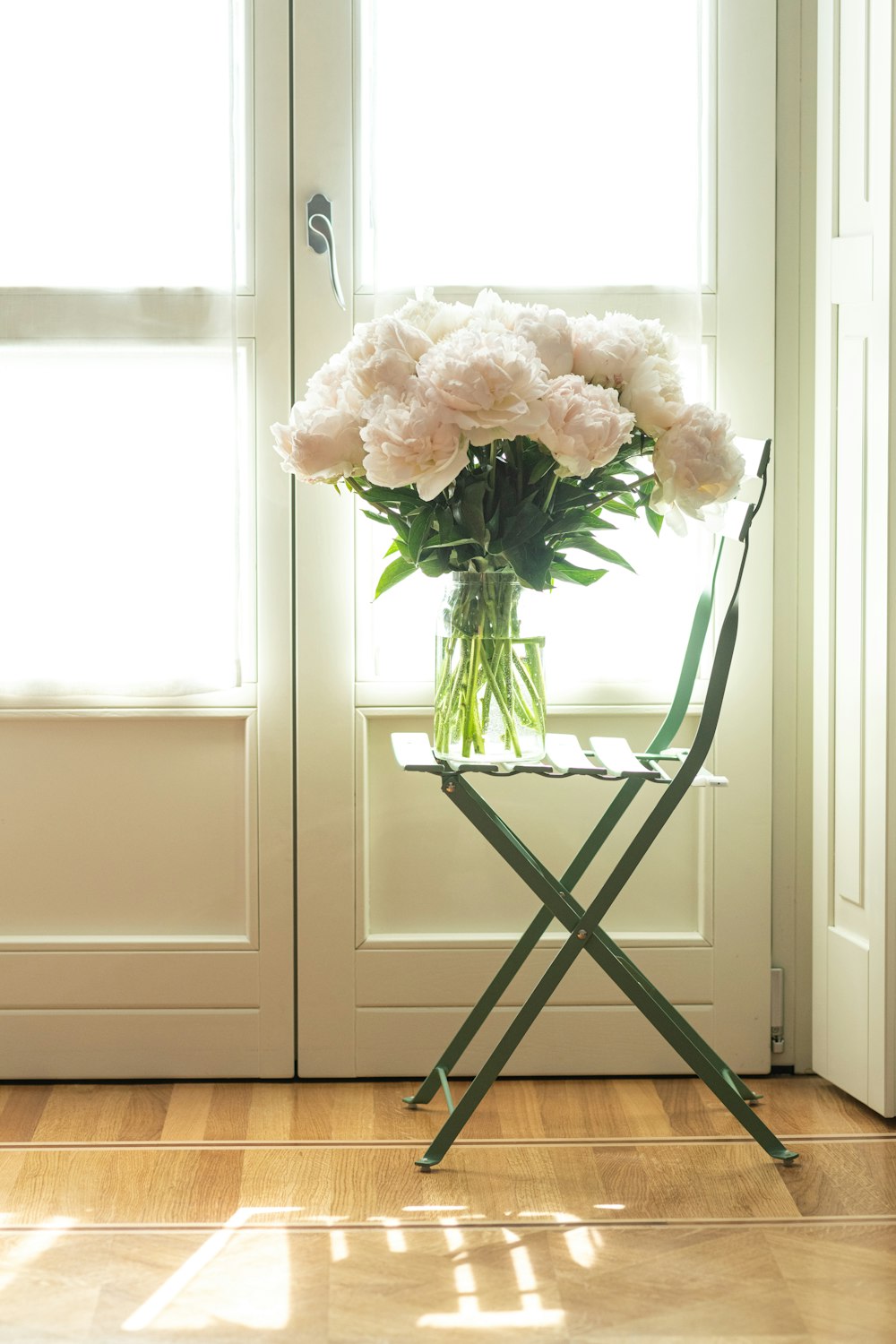 white flower bouquet on brown wooden table