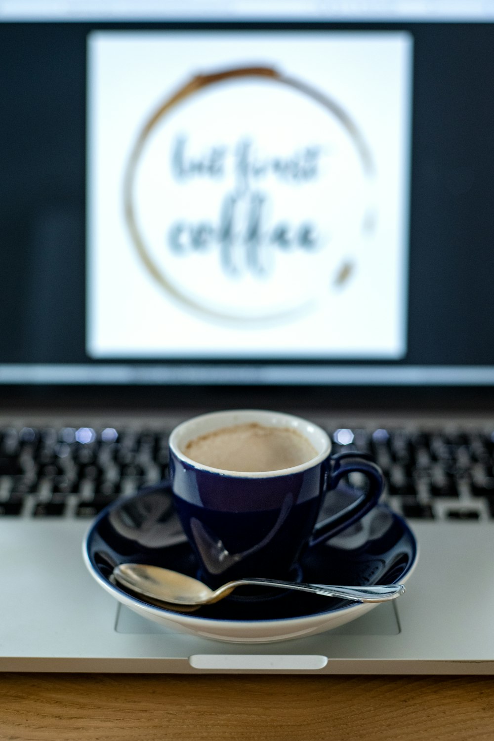 black and white ceramic mug on saucer