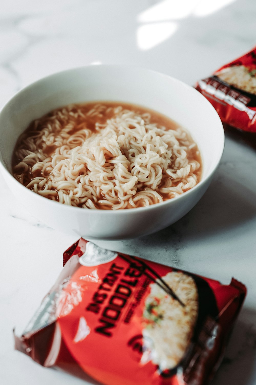 white and red noodle cup