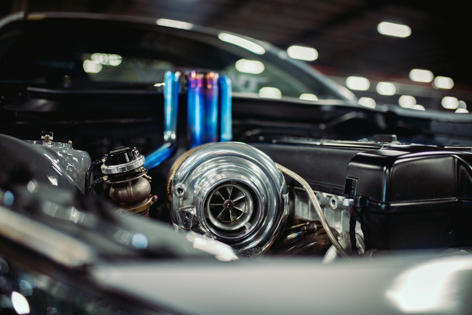 A clean engine bay with a turbo kit installed