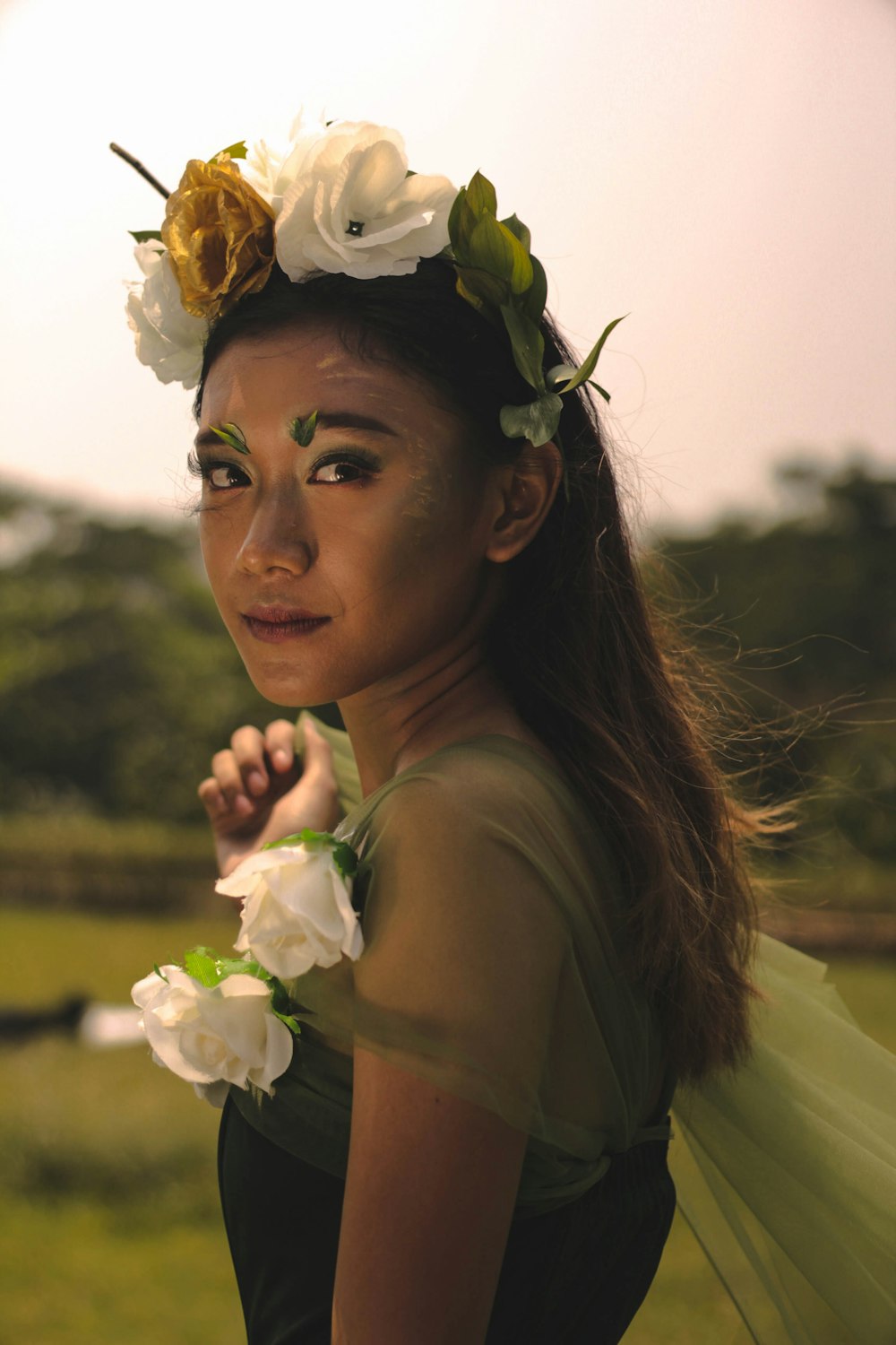 woman in white floral headband