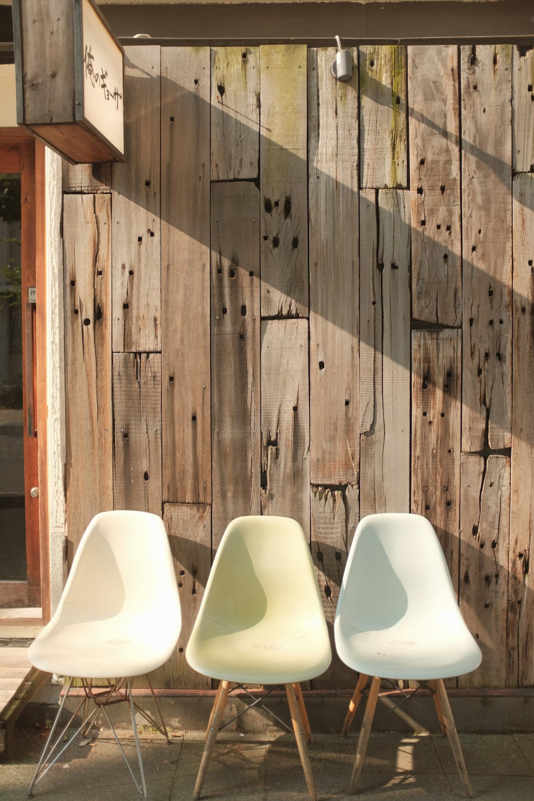 white plastic chairs on brown wooden floor