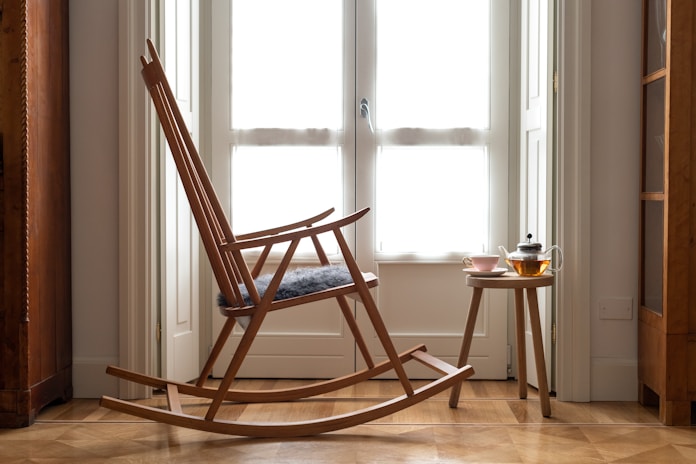rocking chair near window