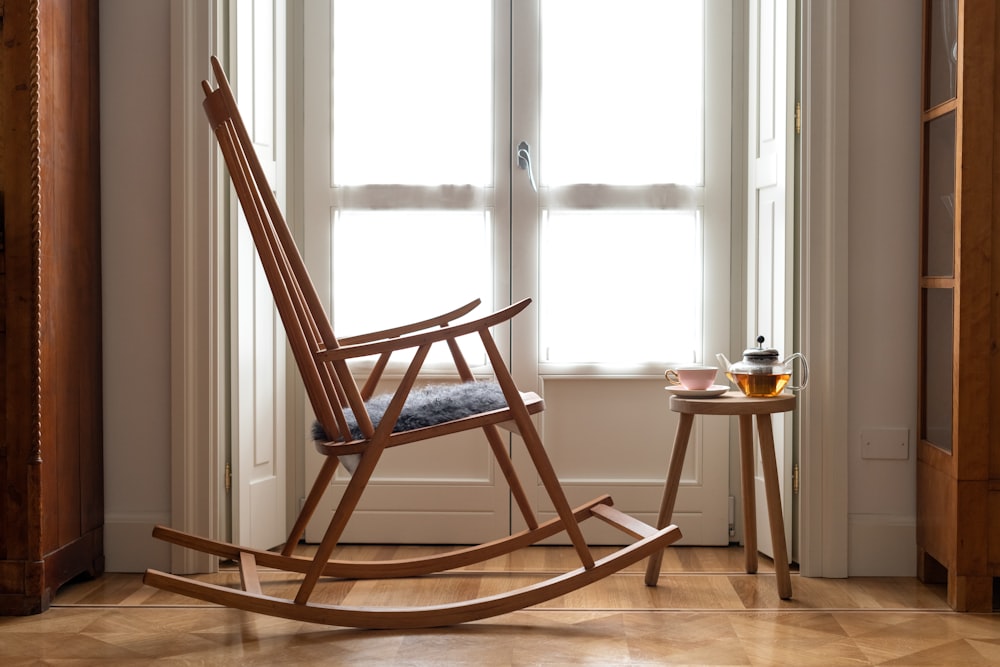 brown wooden chair near window