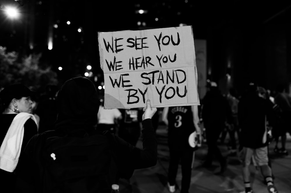 grayscale photo of people walking on street