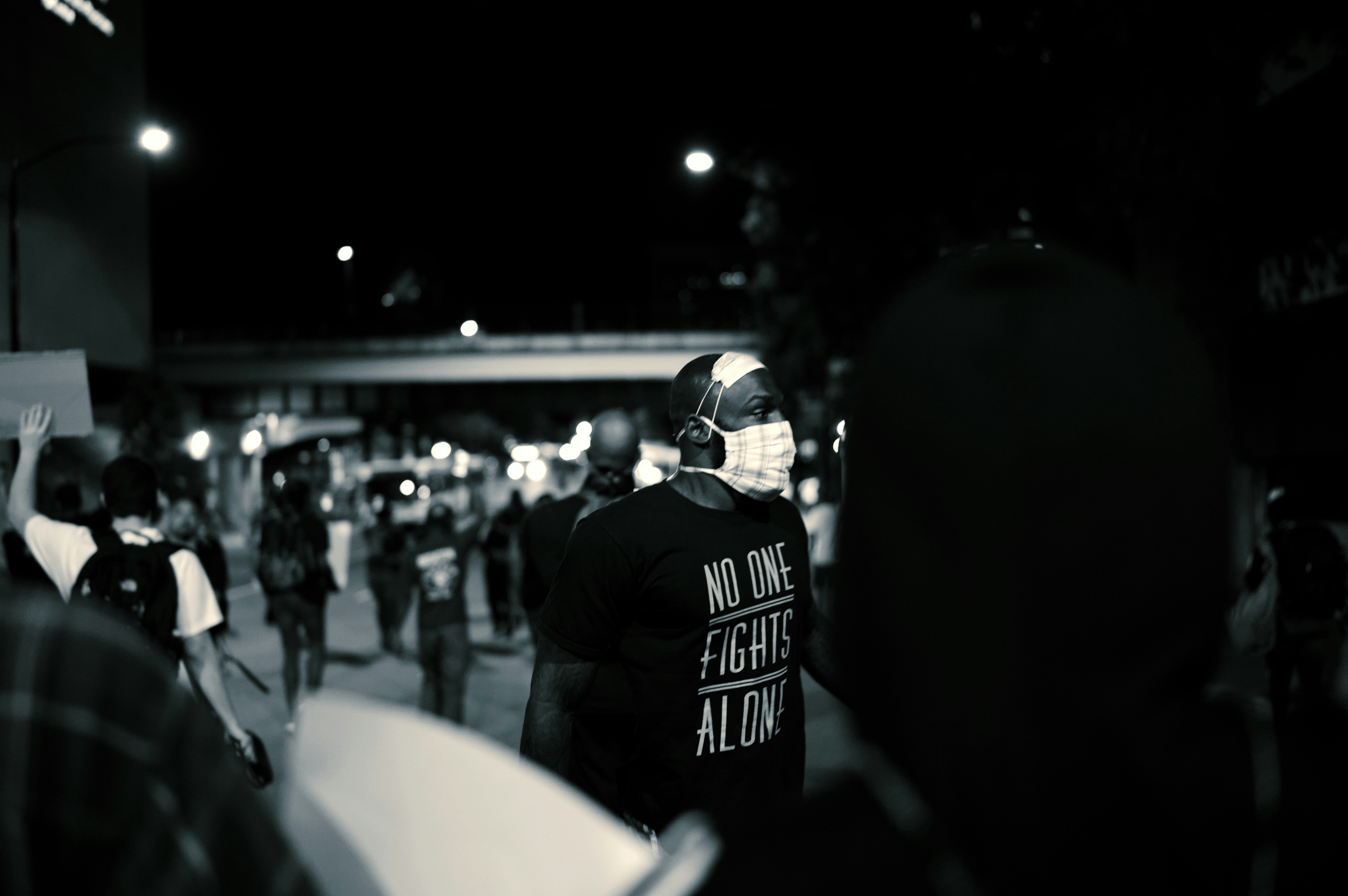 man in black and white jacket wearing black helmet