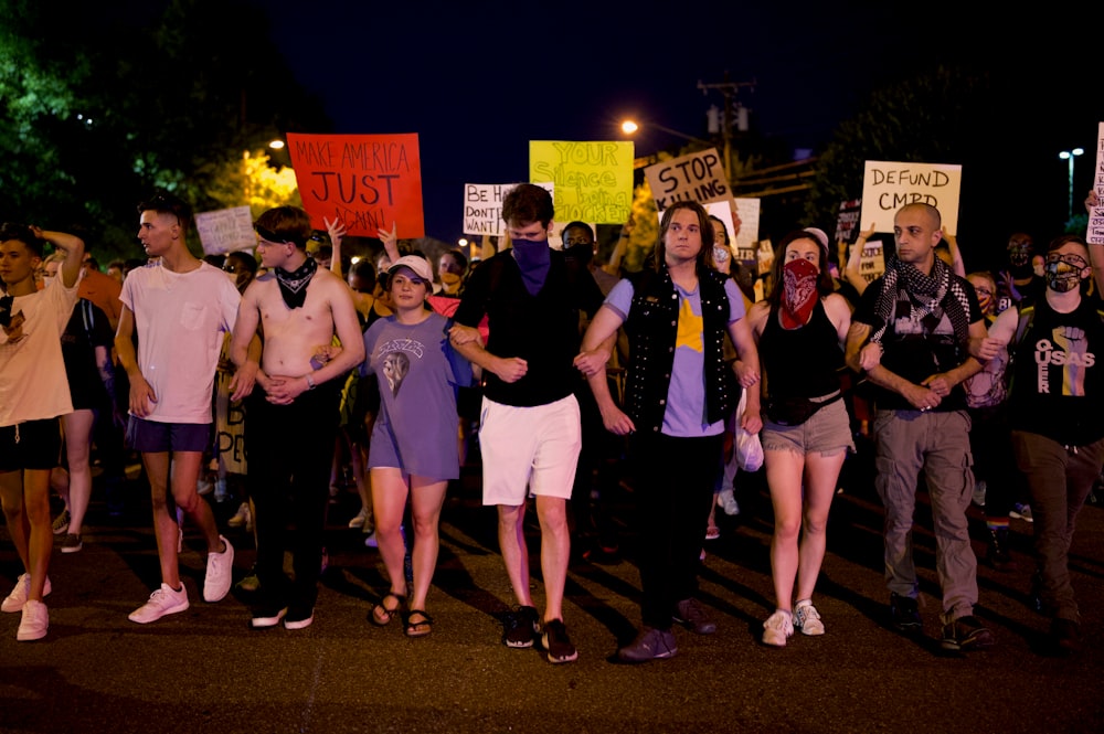 group of people standing on the street