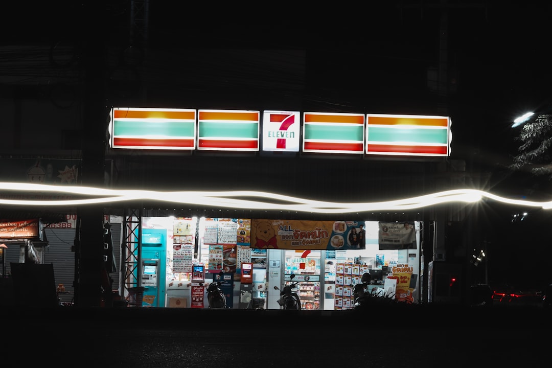 white and red store front during night time