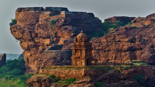 brown concrete building on top of mountain in Badami India
