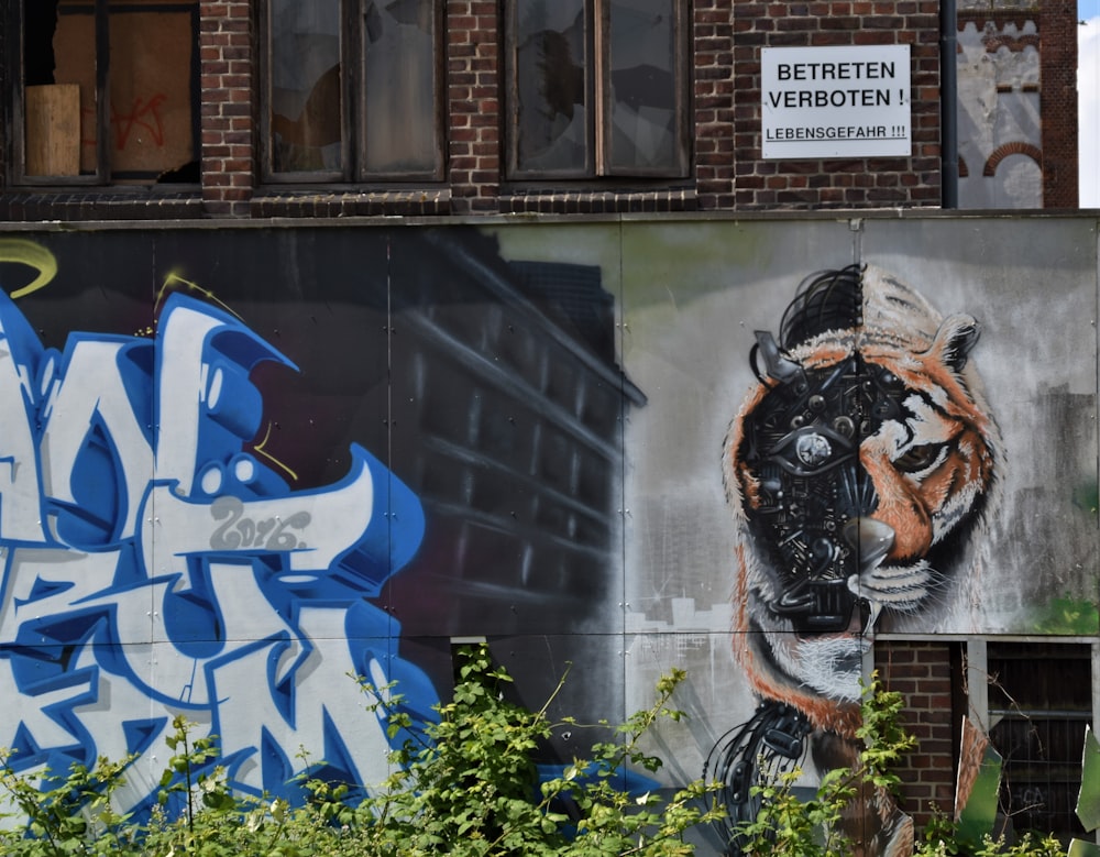 blue and white graffiti on wall