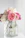 pink roses in clear glass vase