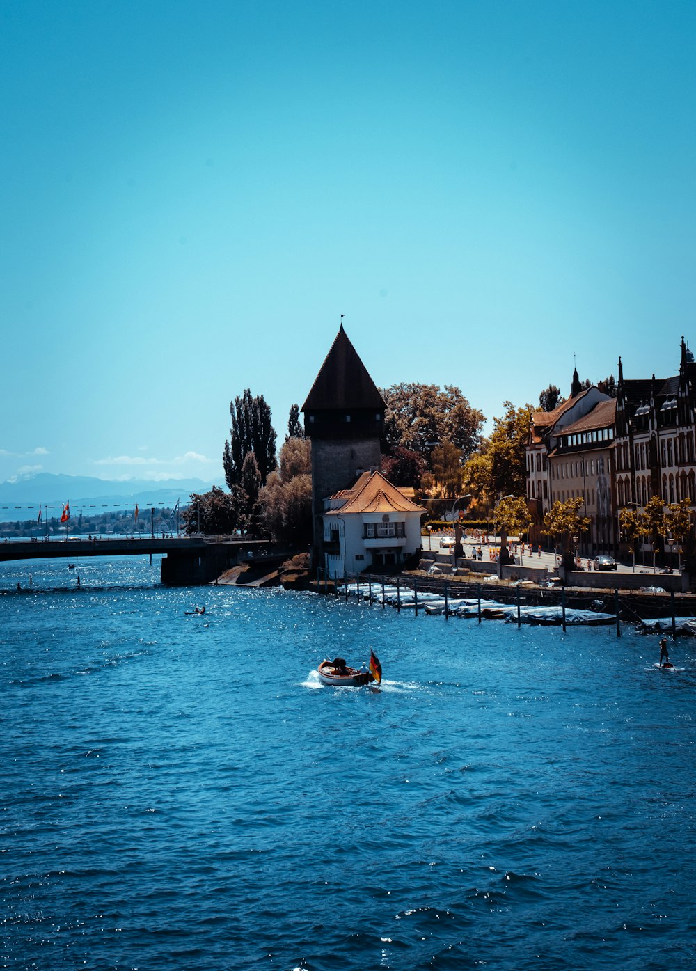 people riding on white boat on river during daytime