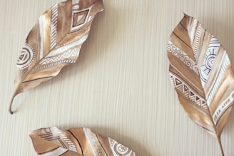 Neem leaves and small neem fruits arranged artistically on a soft brown fabric.